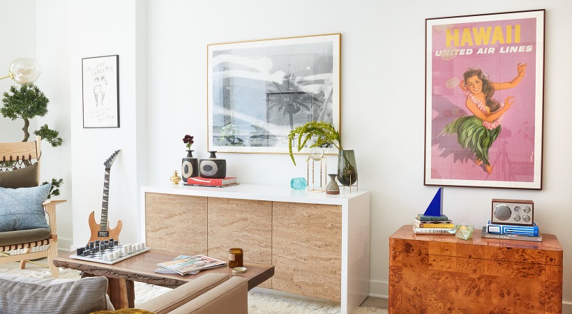 open living area with Hawaii poster