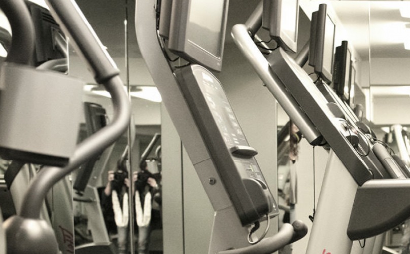 cardio equipment in well lit fitness center