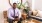 man sits on a chair, smiling in apartment living room