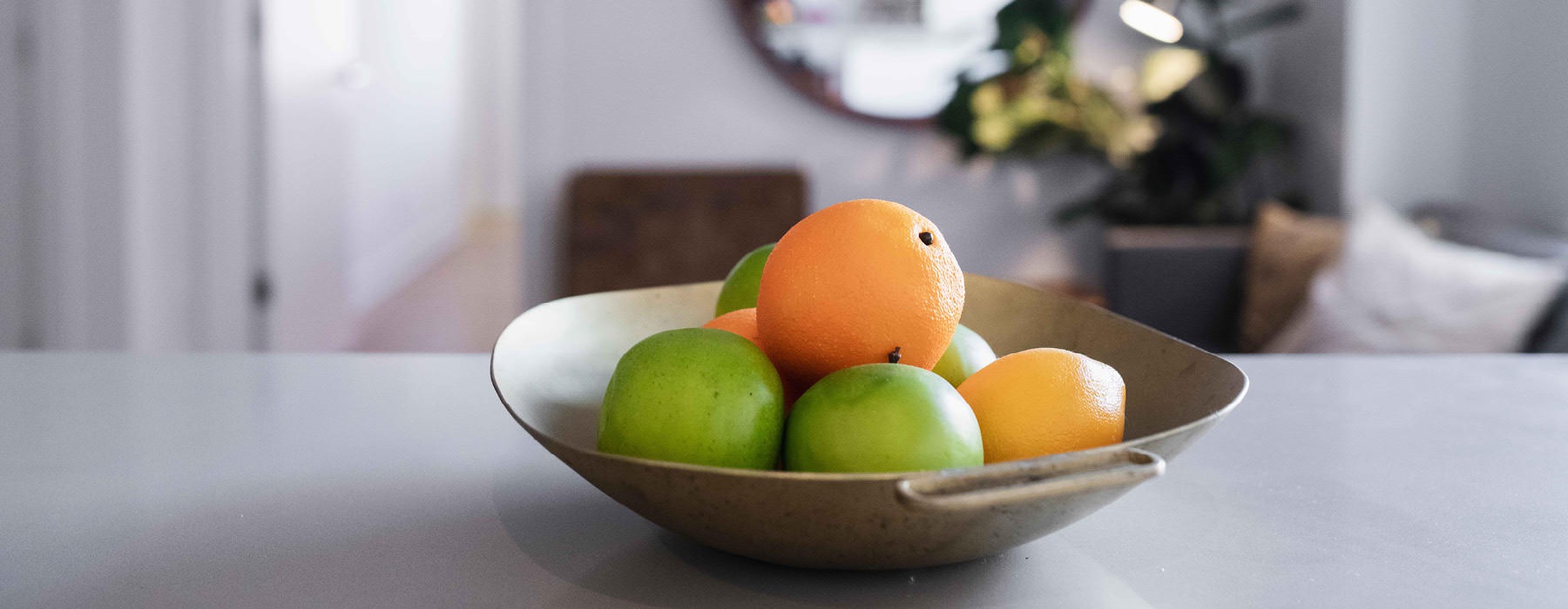 bowl of fruit sits on kitchen counter